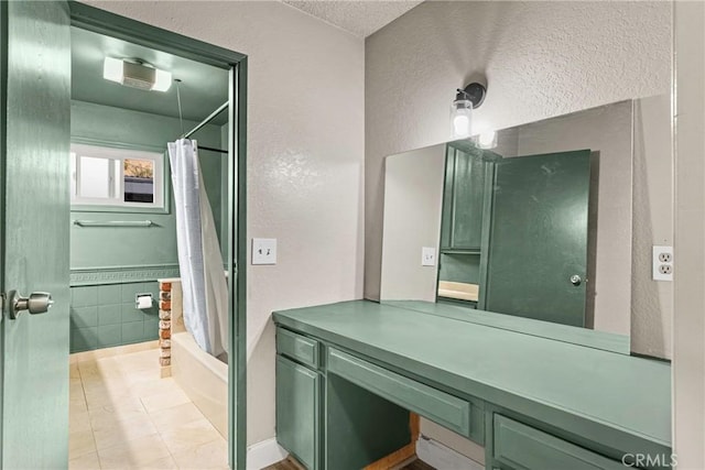26865 Pine Canyon Rd, Lake Hughes, CA 93532 - bathroom featuring a textured ceiling, shower / bathtub combination with curtain, tile patterned floors, and a textured wall