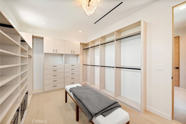 555 N Plymouth Blvd, Hancock Park, CA 90004 - walk in closet with light wood finished floors