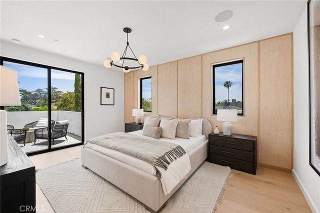 555 N Plymouth Blvd, Hancock Park, CA 90004 - bedroom with light wood-style floors, access to outside, multiple windows, a chandelier, and recessed lighting
