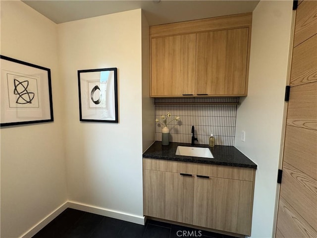 555 N Plymouth Blvd, Hancock Park, CA 90004 - bar area with tasteful backsplash and dark tile patterned floors