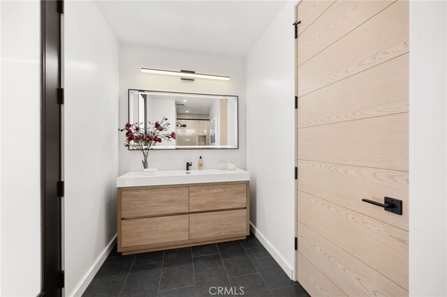 555 N Plymouth Blvd, Hancock Park, CA 90004 - bathroom featuring vanity and tile patterned floors