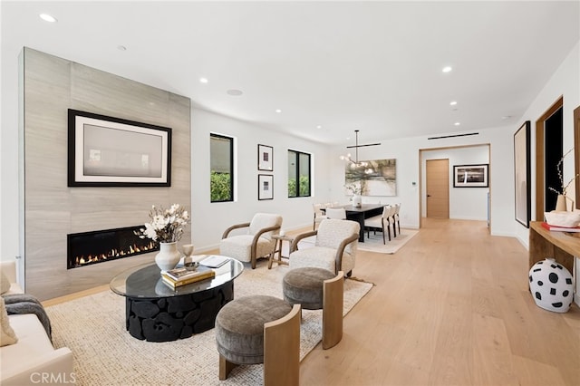 555 N Plymouth Blvd, Hancock Park, CA 90004 - living room with light wood-style flooring, recessed lighting, and a high end fireplace