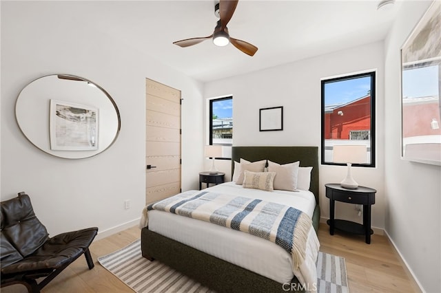 555 N Plymouth Blvd, Hancock Park, CA 90004 - bedroom featuring light wood-style floors and a ceiling fan