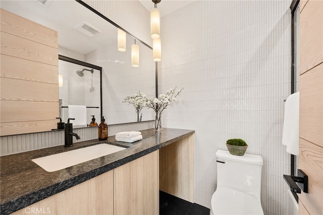 555 N Plymouth Blvd, Hancock Park, CA 90004 - full bathroom featuring tile walls, vanity, and an enclosed shower
