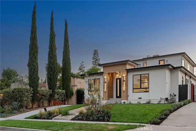 555 N Plymouth Blvd, Hancock Park, CA 90004 - contemporary home featuring a front lawn and stucco siding
