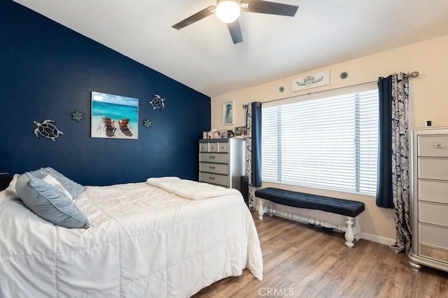 14389 Northstar Ave, Victorville, CA 92392 - bedroom with vaulted ceiling, wood finished floors, and ceiling fan