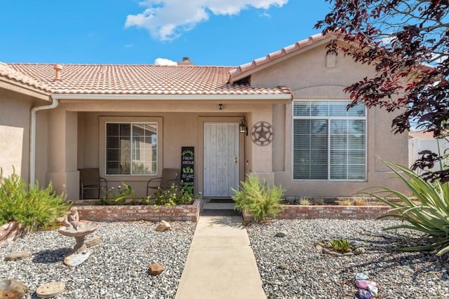14389 Northstar Ave, Victorville, CA 92392 - view of front of property featuring stucco siding, a tiled roof, and a chimney