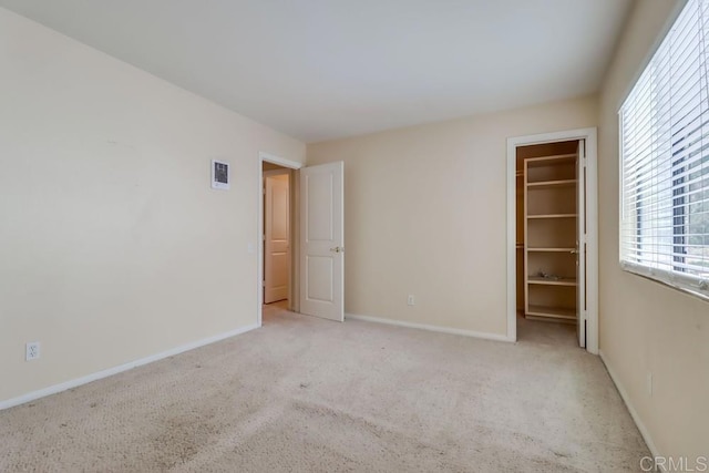 2917 C St Unit 186, San Diego, CA 92102 - unfurnished bedroom with light carpet, a spacious closet, and a closet
