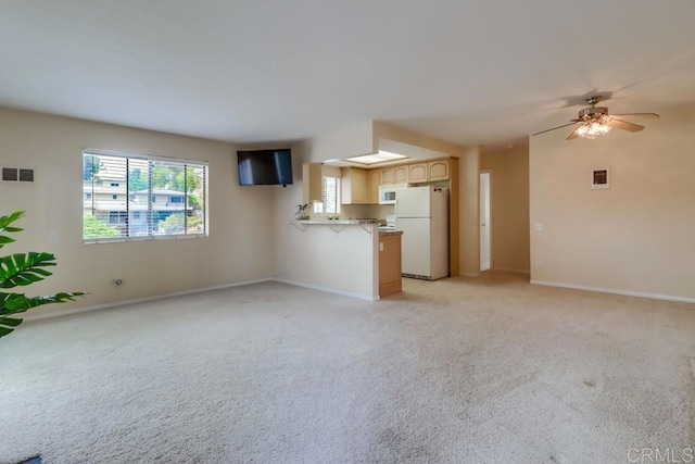 2917 C St Unit 186, San Diego, CA 92102 - unfurnished living room with light carpet and a ceiling fan