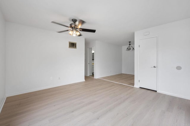 3458 Los Mochis Way, Oceanside, CA 92056 - spare room with light wood finished floors, ceiling fan, and a chandelier