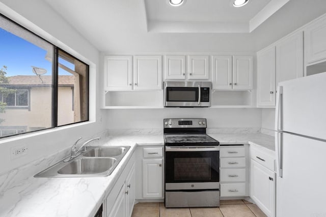 3458 Los Mochis Way, Oceanside, CA 92056 - kitchen with stainless steel appliances, open shelves, recessed lighting, and white cabinets