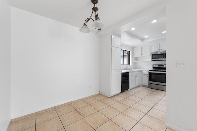 3458 Los Mochis Way, Oceanside, CA 92056 - kitchen featuring appliances with stainless steel finishes, white cabinets, light countertops, recessed lighting, and light tile patterned flooring