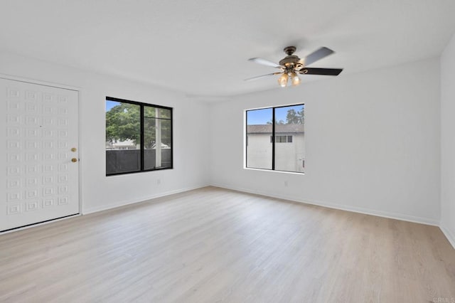 3458 Los Mochis Way, Oceanside, CA 92056 - unfurnished room with plenty of natural light, wood finished floors, and a ceiling fan
