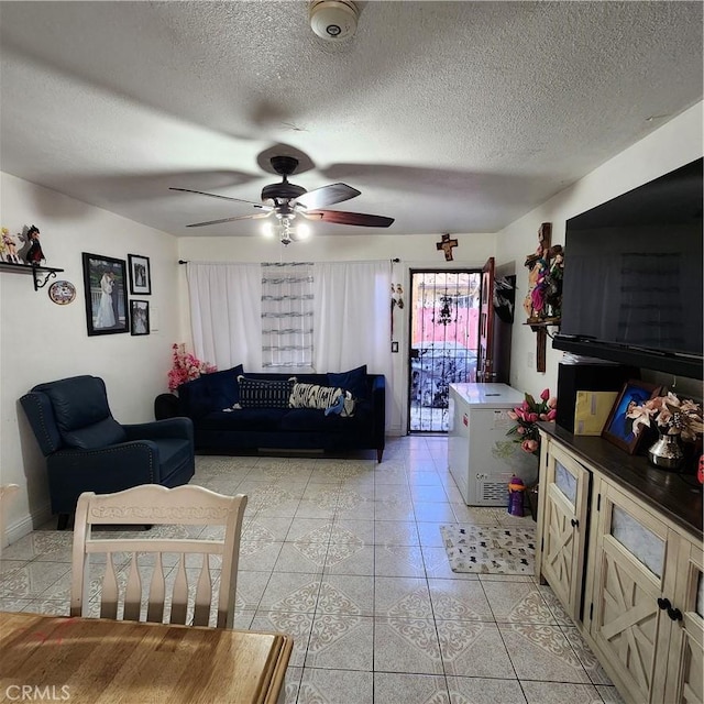 3322 E 8th St, Los Angeles, CA 90023 - living area featuring a ceiling fan, a textured ceiling, and light tile patterned floors
