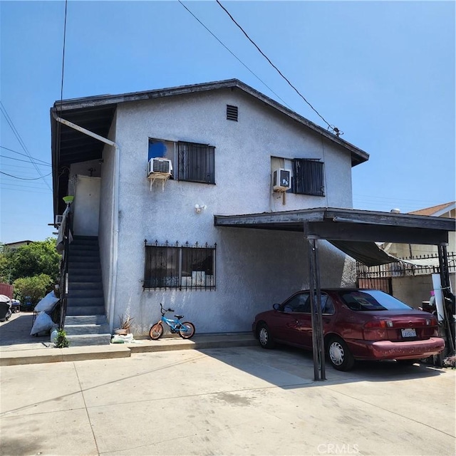 3322 E 8th St, Los Angeles, CA 90023 - view of front of house with stairway and stucco siding