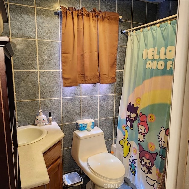 3322 E 8th St, Los Angeles, CA 90023 - bathroom with vanity, tile walls, and shower / bath combo with shower curtain