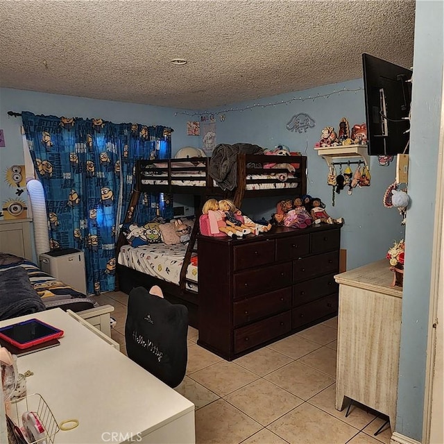 3322 E 8th St, Los Angeles, CA 90023 - bedroom featuring a textured ceiling and tile patterned flooring