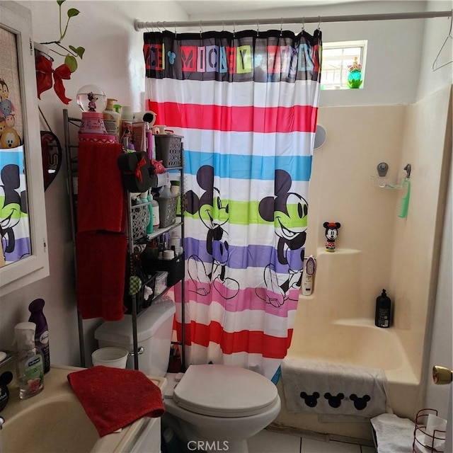 3322 E 8th St, Los Angeles, CA 90023 - bathroom featuring toilet and shower / bath combo with shower curtain