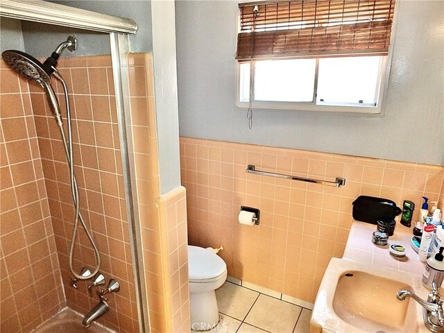 1724 E 1st St Unit 5A, Long Beach, CA 90802 - bathroom with tile walls, tiled shower, tile patterned flooring, and wainscoting