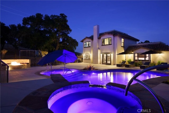 10270 Santa Ana Rd, Atascadero, CA 93422 - pool at twilight featuring french doors, a patio, and a pool with connected hot tub
