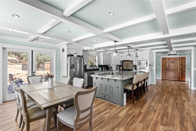 10270 Santa Ana Rd, Atascadero, CA 93422 - dining space with coffered ceiling, beam ceiling, and light wood finished floors