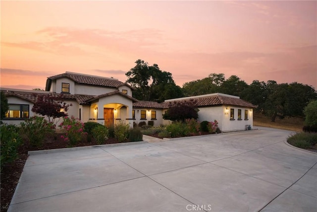 10270 Santa Ana Rd, Atascadero, CA 93422 - mediterranean / spanish home with curved driveway, a tiled roof, and stucco siding