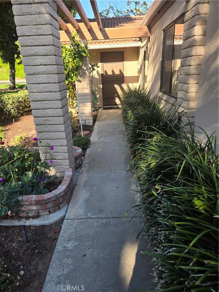 3137 Via Vis Unit A, Laguna Woods, CA 92637 - entrance to property featuring stucco siding and a tiled roof