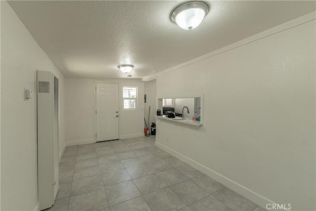 10010 Cedar Ave, Bloomington, CA 92316 - entryway featuring a heating unit, a textured ceiling, and light tile patterned floors
