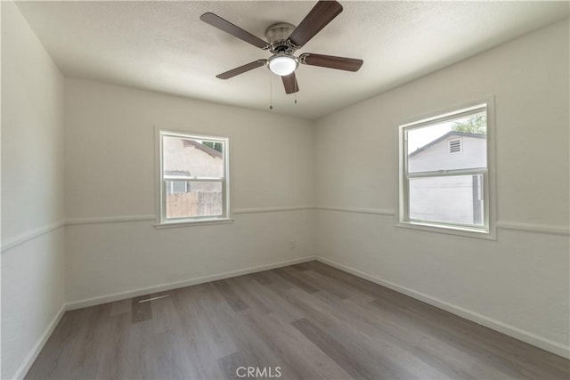 10010 Cedar Ave, Bloomington, CA 92316 - unfurnished room featuring wood finished floors, ceiling fan, and a textured ceiling