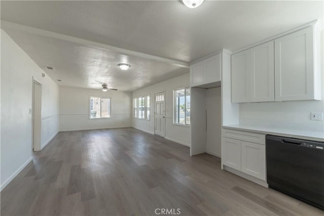 10010 Cedar Ave, Bloomington, CA 92316 - kitchen with black dishwasher, white cabinets, light wood-style floors, ceiling fan, and light countertops