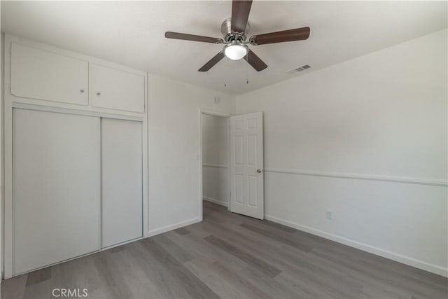 10010 Cedar Ave, Bloomington, CA 92316 - unfurnished bedroom featuring light wood-style floors, a closet, and ceiling fan