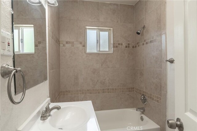 10010 Cedar Ave, Bloomington, CA 92316 - full bathroom featuring healthy amount of natural light and tub / shower combination