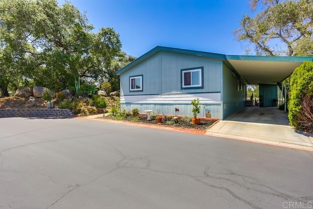 1750 W Citracado Pkwy Unit 157, Escondido, CA 92029 - manufactured / mobile home with concrete driveway and a carport