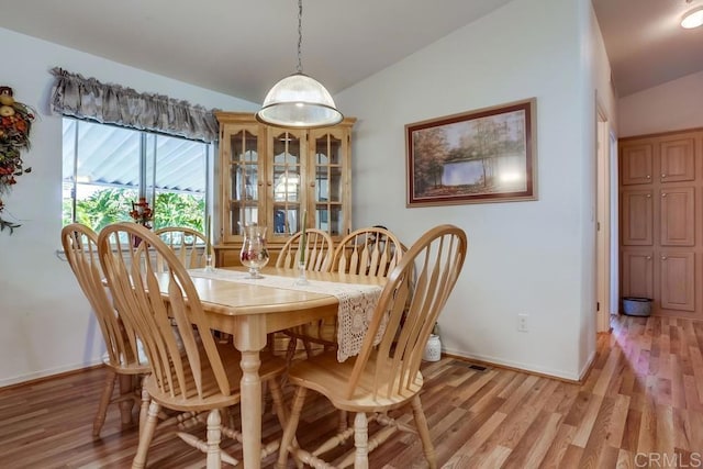 1750 W Citracado Pkwy Unit 157, Escondido, CA 92029 - dining area featuring vaulted ceiling and light wood-style floors