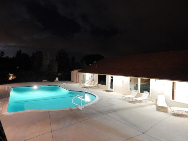1750 W Citracado Pkwy Unit 157, Escondido, CA 92029 - pool at night with a patio area and an outdoor pool