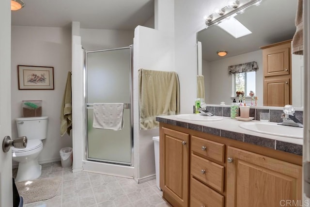 1750 W Citracado Pkwy Unit 157, Escondido, CA 92029 - full bathroom with double vanity, a skylight, a stall shower, and tile patterned floors
