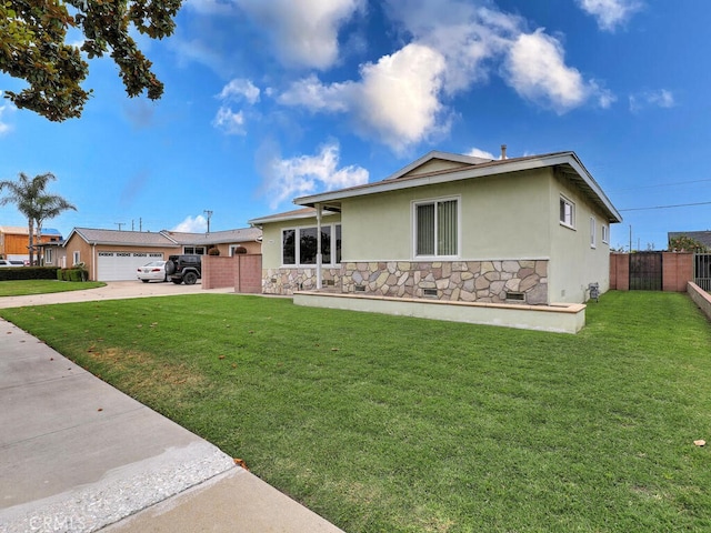 7840 La Mesa Way, Buena Park, CA 90620 - view of front of home with stone siding, stucco siding, driveway, and a garage