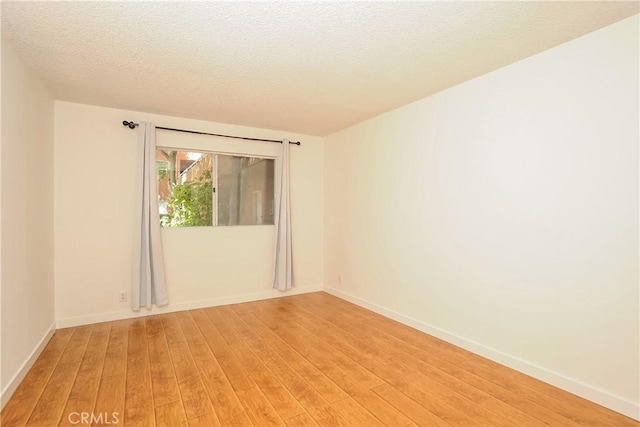 12601 Van Nuys Blvd Unit 103, Pacoima, CA 91331 - spare room featuring light wood finished floors and a textured ceiling