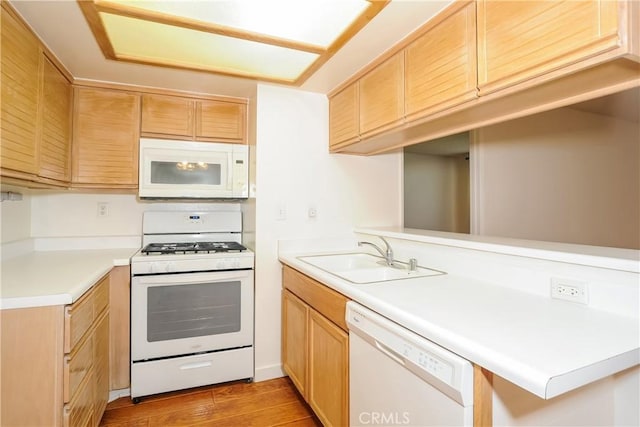12601 Van Nuys Blvd Unit 103, Pacoima, CA 91331 - kitchen featuring white appliances, light wood-style floors, light countertops, and a peninsula