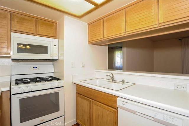12601 Van Nuys Blvd Unit 103, Pacoima, CA 91331 - kitchen featuring white appliances, light countertops, and brown cabinets