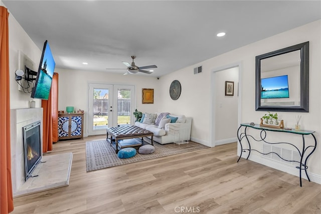 10480 Bryan St, Riverside, CA 92505 - living room with a ceiling fan, light wood finished floors, a fireplace, french doors, and recessed lighting
