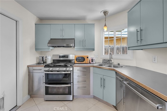 10480 Bryan St, Riverside, CA 92505 - kitchen featuring appliances with stainless steel finishes, extractor fan, decorative light fixtures, and light tile patterned floors