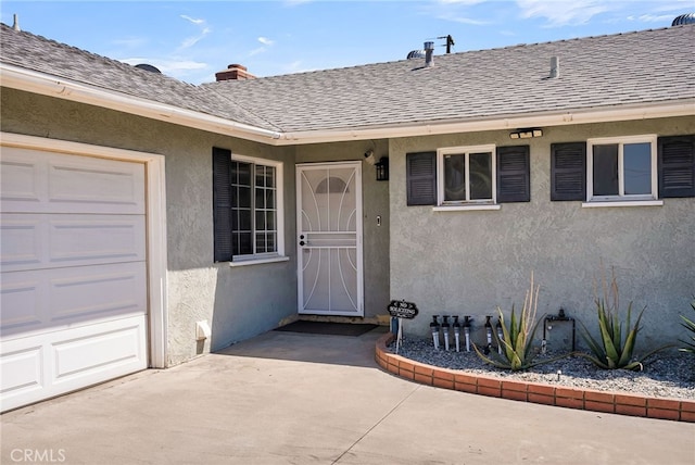 10480 Bryan St, Riverside, CA 92505 - view of exterior entry featuring a shingled roof and stucco siding