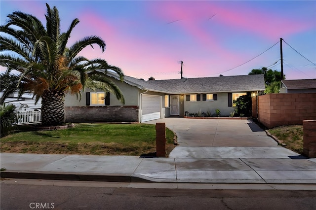 10480 Bryan St, Riverside, CA 92505 - single story home featuring driveway, an attached garage, and stucco siding