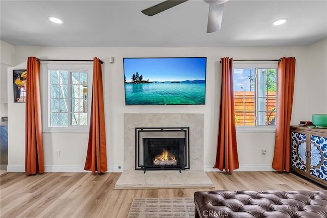 10480 Bryan St, Riverside, CA 92505 - living area featuring wood finished floors, a premium fireplace, ceiling fan, and recessed lighting