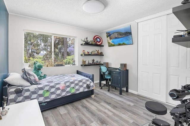 834 Cole Ranch Rd, Encinitas, CA 92024 - bedroom featuring a textured ceiling, wood finished floors, and a closet