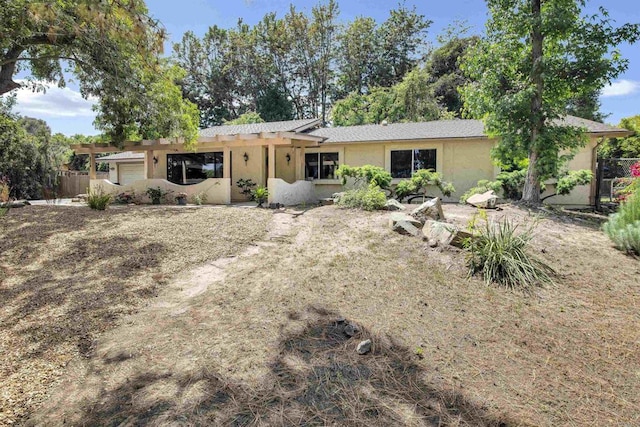 834 Cole Ranch Rd, Encinitas, CA 92024 - rear view of property featuring stucco siding, an attached garage, and a pergola