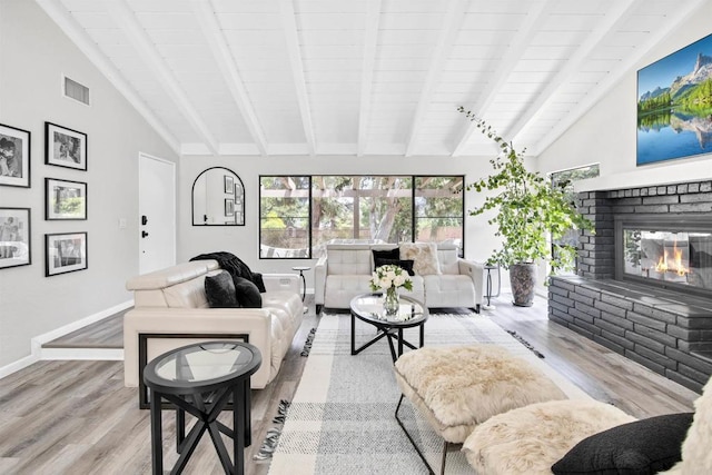 834 Cole Ranch Rd, Encinitas, CA 92024 - living room featuring wood finished floors, a fireplace, beam ceiling, and high vaulted ceiling