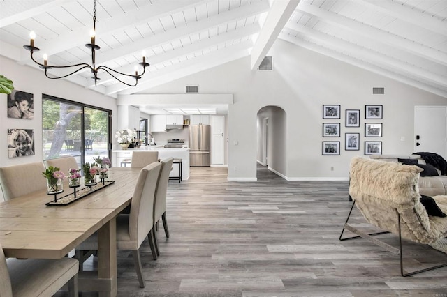 834 Cole Ranch Rd, Encinitas, CA 92024 - dining area featuring a chandelier, light wood finished floors, a wood ceiling with exposed beams, arched walkways, and high vaulted ceiling