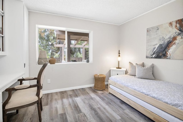 834 Cole Ranch Rd, Encinitas, CA 92024 - bedroom with wood finished floors, a textured ceiling, and crown molding